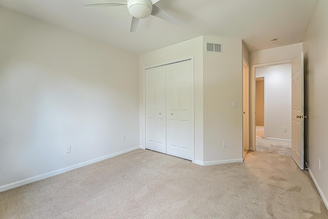 1544 Newport Creek Dr, Ann Arbor, MI 48103 - unfurnished bedroom with light colored carpet, a closet, and a ceiling fan