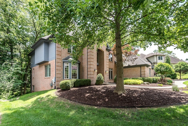 1544 Newport Creek Dr, Ann Arbor, MI 48103 - view of front facade featuring brick siding and a front yard