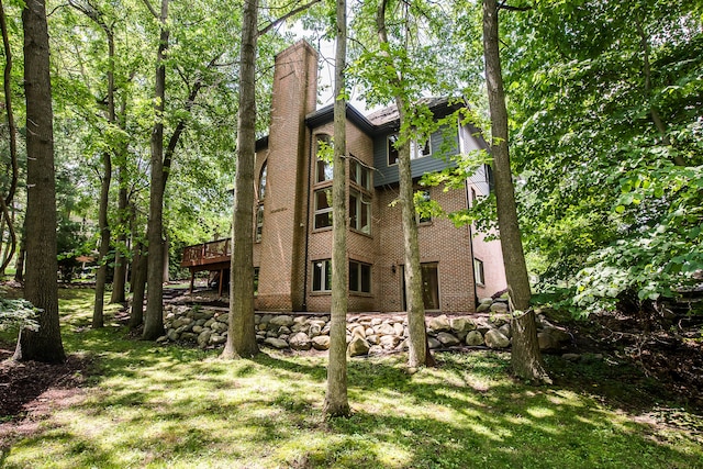 1544 Newport Creek Dr, Ann Arbor, MI 48103 - back of house with a deck, a chimney, and a yard