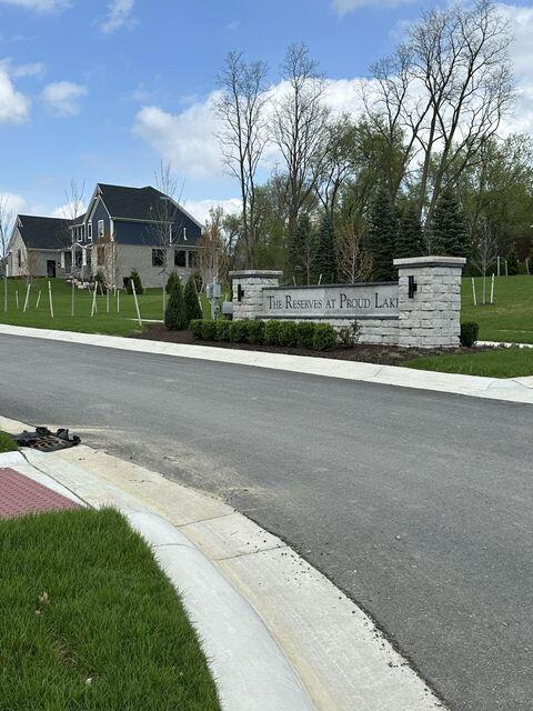 3490 Mare Cir, Wixom, MI 48393 - view of asphalt road with sidewalks