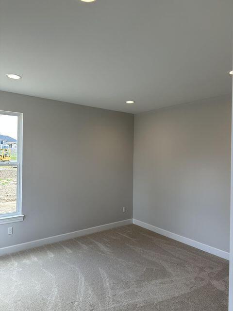 3490 Mare Cir, Wixom, MI 48393 - carpeted spare room with baseboards and recessed lighting