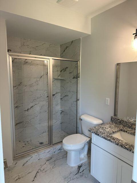 3490 Mare Cir, Wixom, MI 48393 - bathroom featuring vanity, a marble finish shower, and marble finish flooring