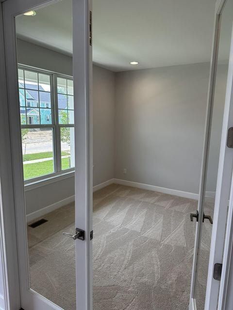 3490 Mare Cir, Wixom, MI 48393 - empty room with carpet and recessed lighting