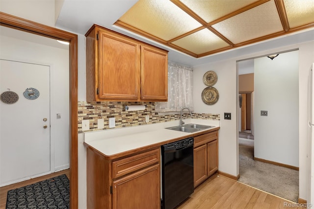 5419 Duke Ct, Warren, MI 48091 - kitchen featuring black dishwasher, decorative backsplash, light countertops, brown cabinetry, and light wood finished floors