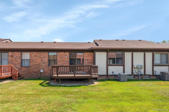5419 Duke Ct, Warren, MI 48091 - rear view of property featuring a wooden deck, a lawn, brick siding, and stucco siding