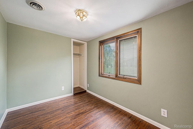 36680 Howard Rd, Farmington, MI 48331 - unfurnished bedroom with dark wood-type flooring and a closet