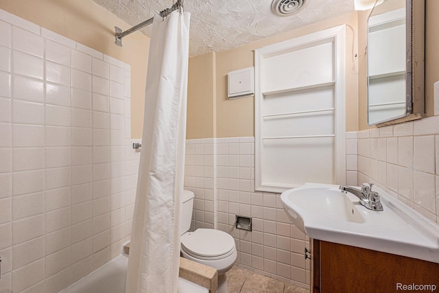 36680 Howard Rd, Farmington, MI 48331 - full bathroom featuring tile walls, vanity, a textured ceiling, tile patterned floors, and shower / tub combo with curtain