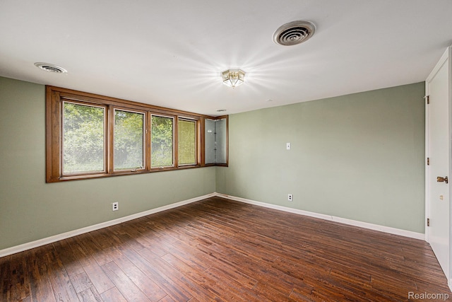 36680 Howard Rd, Farmington, MI 48331 - empty room featuring baseboards and dark wood-type flooring