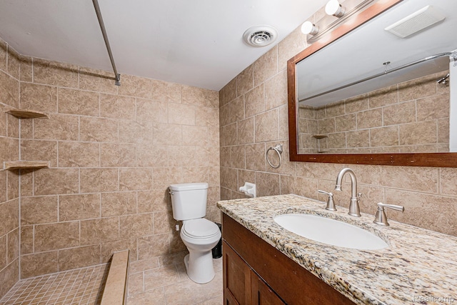 36680 Howard Rd, Farmington, MI 48331 - full bath with tile walls, vanity, a tile shower, backsplash, and tile patterned floors