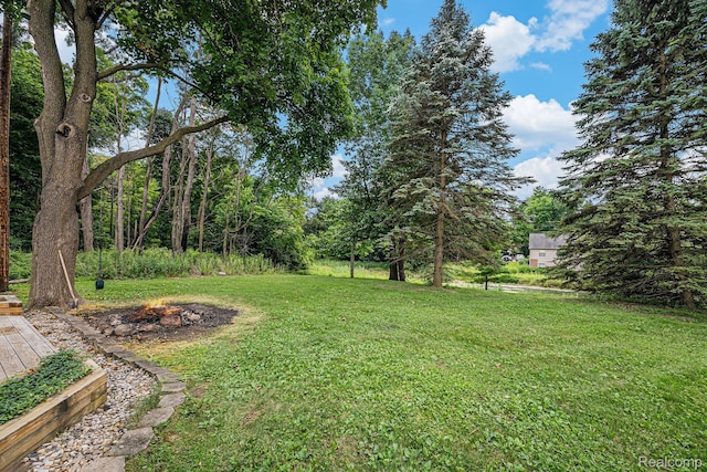 36680 Howard Rd, Farmington, MI 48331 - view of green lawn with a fire pit