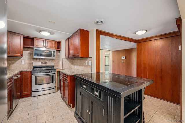 36680 Howard Rd, Farmington, MI 48331 - kitchen with stainless steel appliances, open shelves, tasteful backsplash, a peninsula, and wood walls