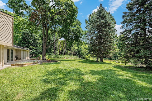 36680 Howard Rd, Farmington, MI 48331 - view of green lawn with a patio area