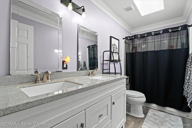 9125 Mandon Rd, White Lake, MI 48386 - bathroom with crown molding, double vanity, a shower with shower curtain, and wood finished floors