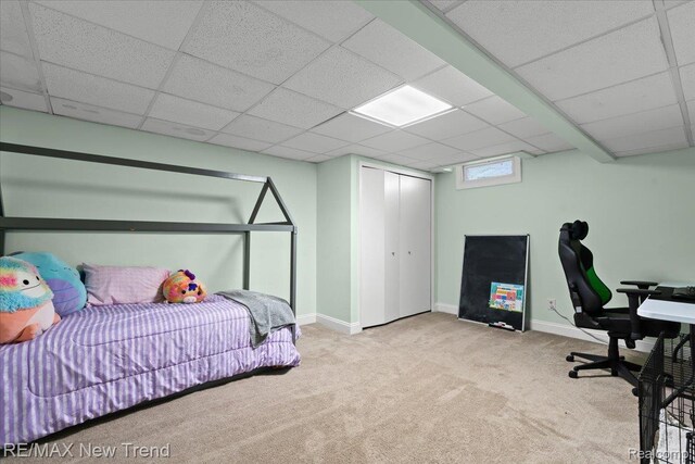 9125 Mandon Rd, White Lake, MI 48386 - carpeted bedroom with a drop ceiling and a closet