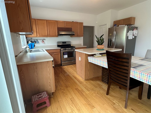 33555 Birchlawn, Westland, MI 48185 - kitchen featuring stainless steel appliances, extractor fan, light countertops, light wood-type flooring, and a kitchen island