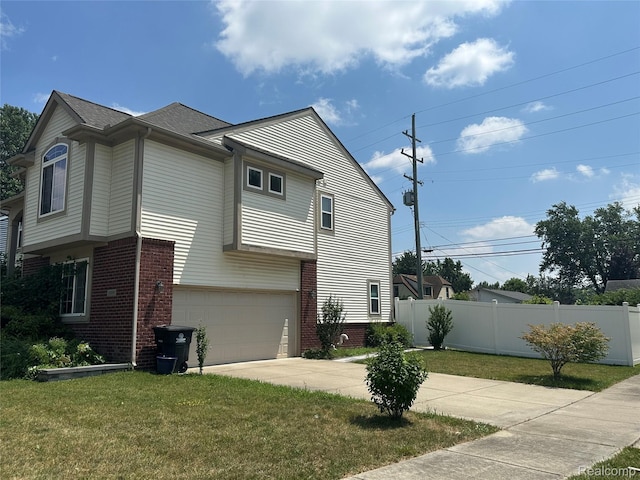 33555 Birchlawn, Westland, MI 48185 - view of home's exterior with brick siding, an attached garage, and driveway