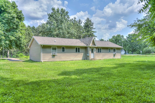 2922-2926 Chapel Rd, Parma, MI 49269 - rear view of property featuring a yard and cooling unit