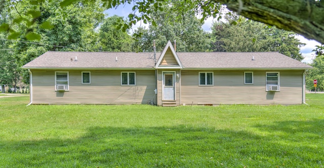 2922-2926 Chapel Rd, Parma, MI 49269 - rear view of house featuring entry steps, a lawn, cooling unit, and a shingled roof