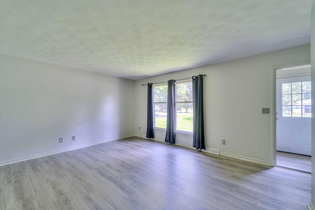 2922-2926 Chapel Rd, Parma, MI 49269 - spare room with wood finished floors and baseboards