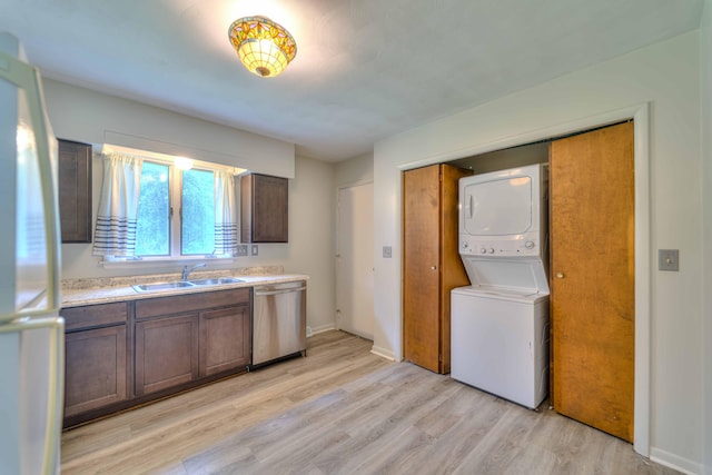 2922-2926 Chapel Rd, Parma, MI 49269 - laundry room with stacked washer and clothes dryer and light wood-type flooring