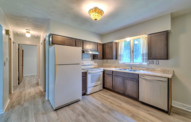 2922-2926 Chapel Rd, Parma, MI 49269 - kitchen with white appliances, light wood finished floors, and light countertops