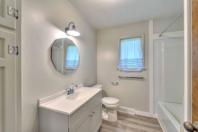 2922-2926 Chapel Rd, Parma, MI 49269 - bathroom featuring vanity, wood finished floors, and shower / bath combination