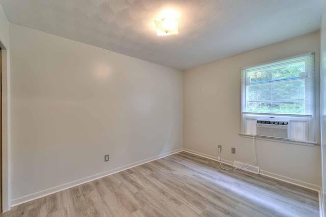 2922-2926 Chapel Rd, Parma, MI 49269 - spare room featuring light wood-type flooring and cooling unit