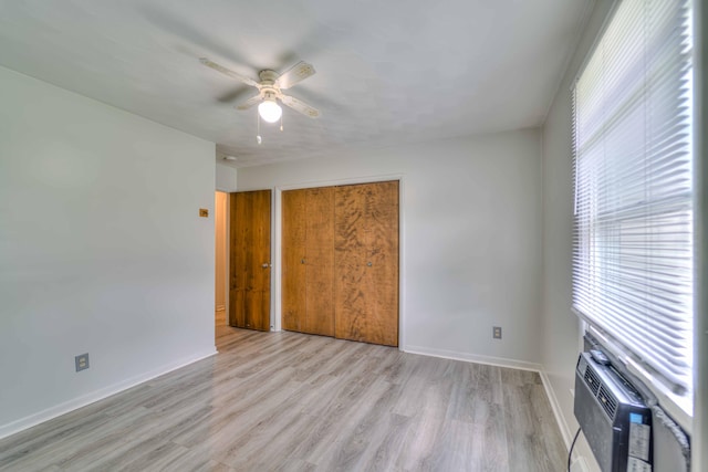 2922-2926 Chapel Rd, Parma, MI 49269 - unfurnished bedroom with light wood finished floors, a closet, and ceiling fan