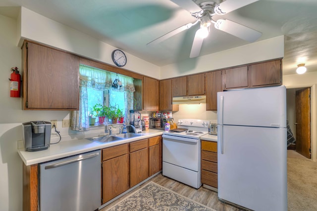 2922-2926 Chapel Rd, Parma, MI 49269 - kitchen featuring white appliances, under cabinet range hood, a ceiling fan, light countertops, and brown cabinetry
