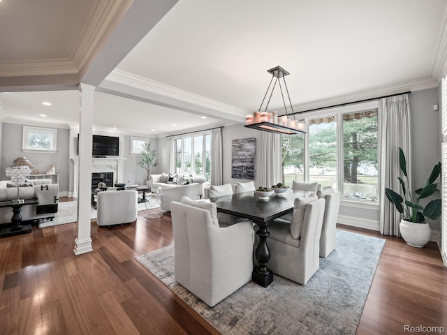 1200 Shipman Blvd, Birmingham, MI 48009 - dining space featuring crown molding, dark wood-type flooring, a fireplace, decorative columns, and recessed lighting