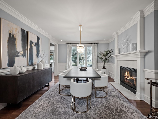 1200 Shipman Blvd, Birmingham, MI 48009 - dining space with a chandelier, a high end fireplace, wainscoting, crown molding, and dark wood-type flooring