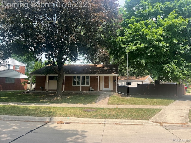 29508 Roan Dr, Warren, MI 48093 - view of front facade with brick siding and a front yard