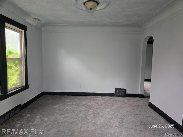 9379 Manor St, Detroit, MI 48204 - unfurnished room featuring arched walkways and carpet
