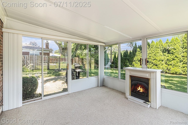 3847 Dwight Dr, Warren, MI 48092 - unfurnished sunroom featuring a glass covered fireplace and vaulted ceiling