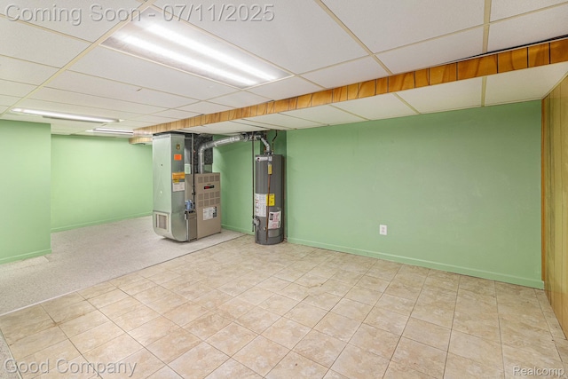 3847 Dwight Dr, Warren, MI 48092 - finished below grade area featuring heating unit, water heater, a drop ceiling, and tile patterned flooring