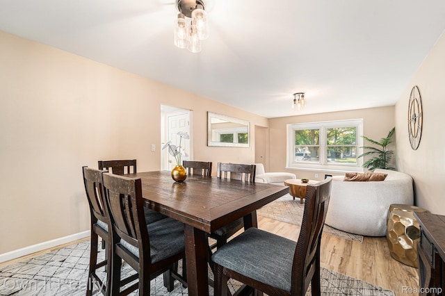 14128 Ellen Dr, Dearborn Heights, MI 48154 - dining area with light wood-style flooring and baseboards