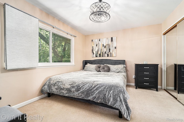 14128 Ellen Dr, Dearborn Heights, MI 48154 - bedroom with carpet floors, a closet, and a chandelier
