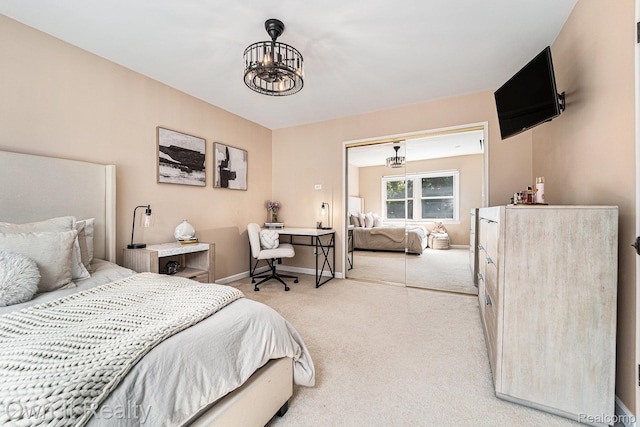 14128 Ellen Dr, Dearborn Heights, MI 48154 - bedroom featuring a chandelier and light colored carpet