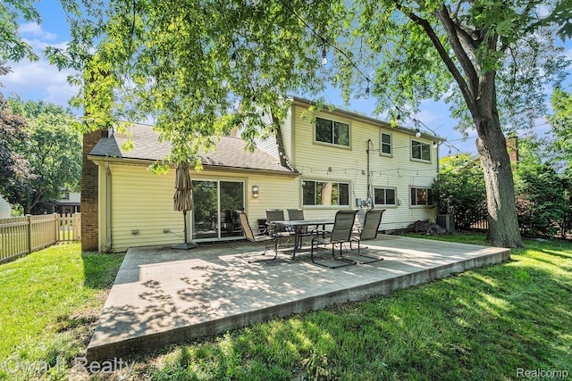 14128 Ellen Dr, Dearborn Heights, MI 48154 - back of property featuring a patio area and a chimney