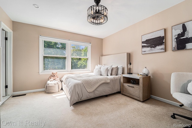 14128 Ellen Dr, Dearborn Heights, MI 48154 - bedroom with light colored carpet and a chandelier