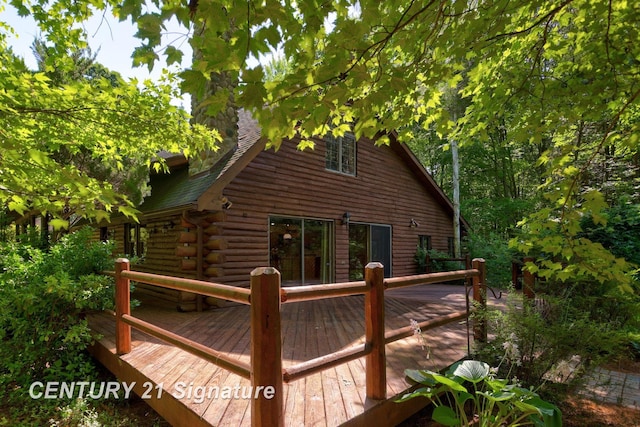 13715 Baldwin Rd, Saginaw, MI 48616 - back of property with a wooden deck and log siding