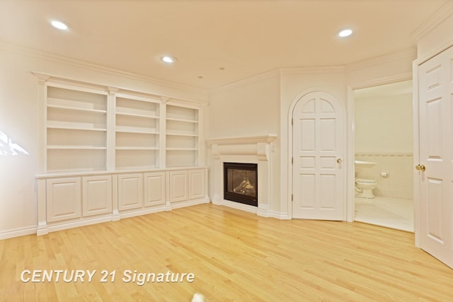 13715 Baldwin Rd, Saginaw, MI 48616 - unfurnished living room with light wood-style floors, ornamental molding, a glass covered fireplace, and recessed lighting