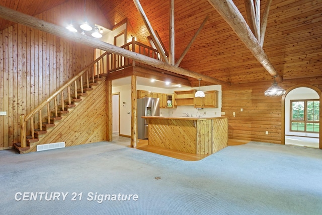 13715 Baldwin Rd, Saginaw, MI 48616 - kitchen featuring stainless steel fridge with ice dispenser, wood walls, high vaulted ceiling, light carpet, and a wooden ceiling with exposed beams