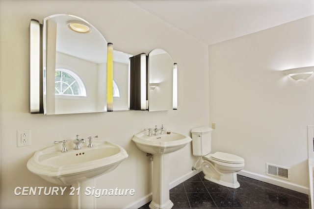 13715 Baldwin Rd, Saginaw, MI 48616 - bathroom featuring baseboards and tile patterned flooring