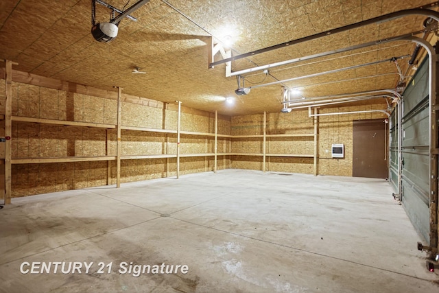 13715 Baldwin Rd, Saginaw, MI 48616 - garage with heating unit and a garage door opener