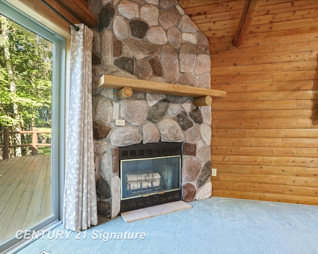 13715 Baldwin Rd, Saginaw, MI 48616 - detailed view of a fireplace, carpet, and wood walls