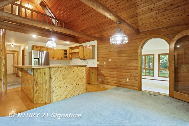 13715 Baldwin Rd, Saginaw, MI 48616 - kitchen featuring stainless steel fridge with ice dispenser, open shelves, light countertops, wood walls, and brown cabinetry