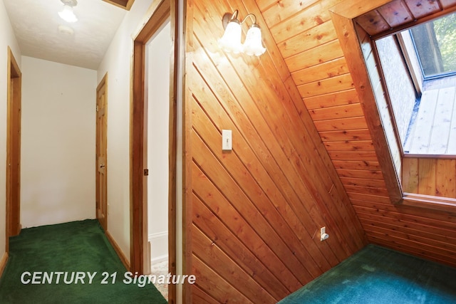 13715 Baldwin Rd, Saginaw, MI 48616 - hallway with carpet floors and wood walls
