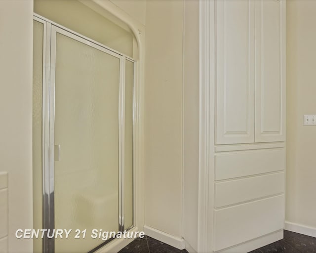 13715 Baldwin Rd, Saginaw, MI 48616 - full bath featuring a shower stall and baseboards
