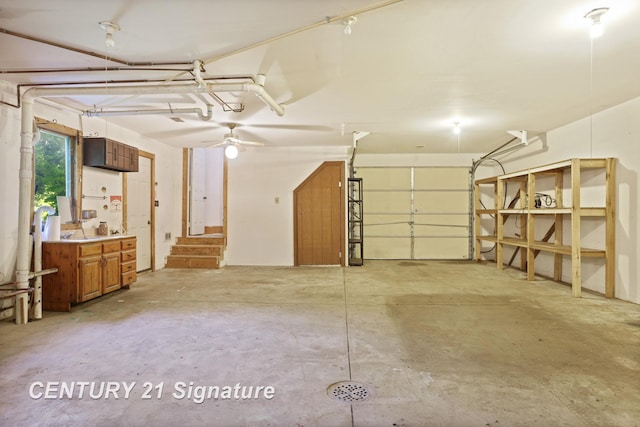 13715 Baldwin Rd, Saginaw, MI 48616 - garage featuring a ceiling fan